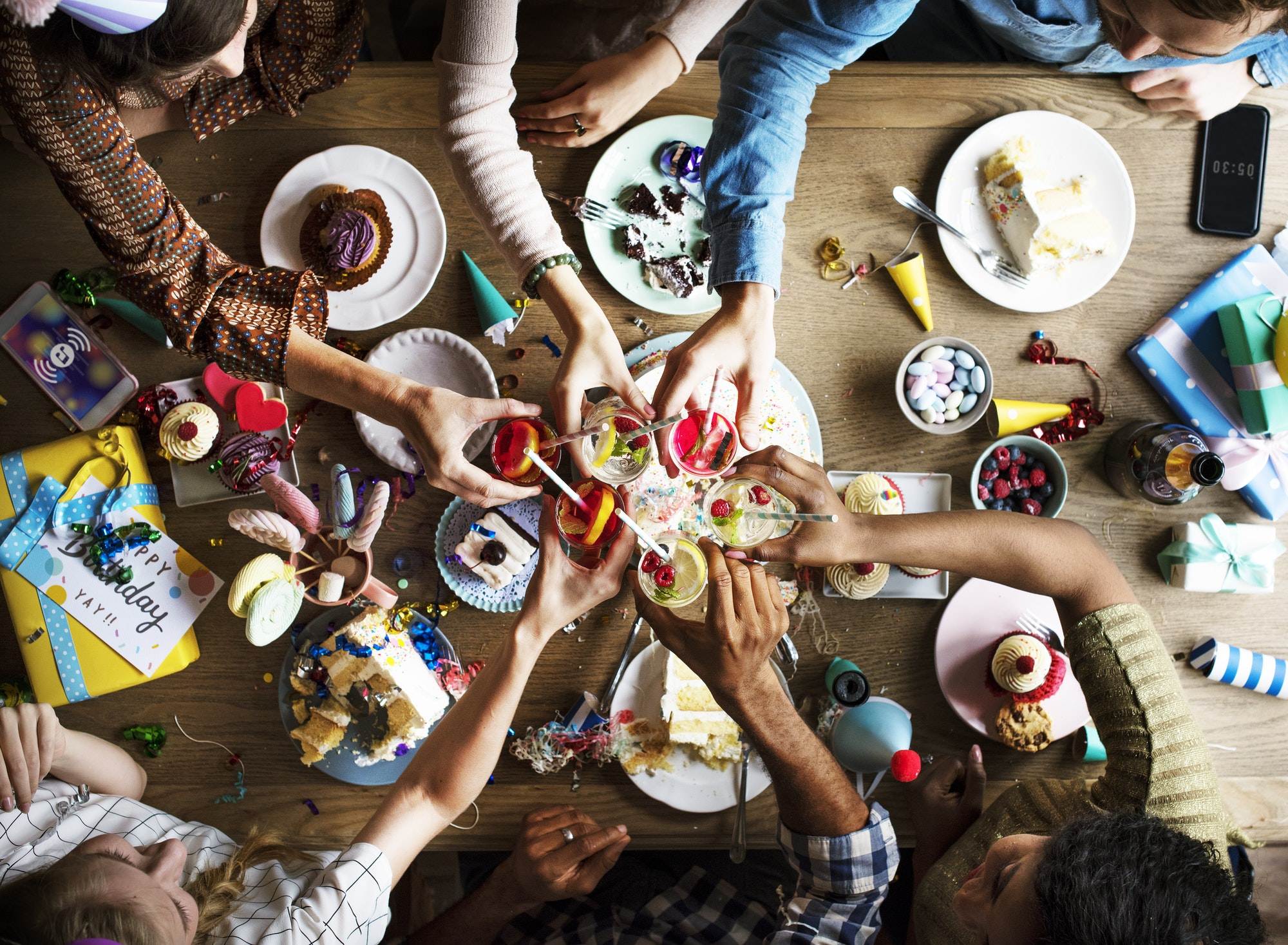 People Clinging Drinks Together on Birthday Party